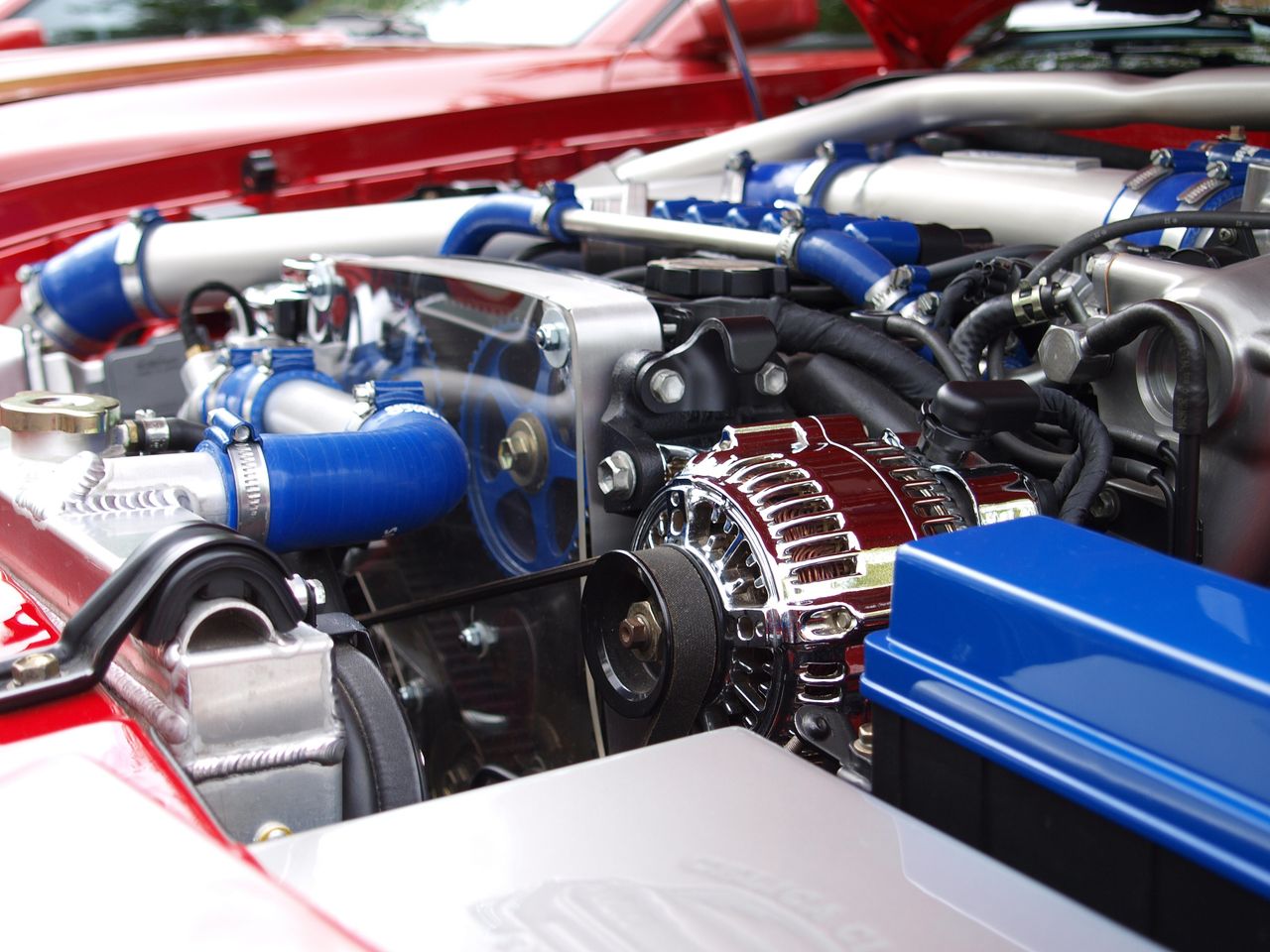 Crafting Captivating Headlines: Your awesome post title goes here Detailed view of a clean modern car engine with vibrant colored components and sleek design.